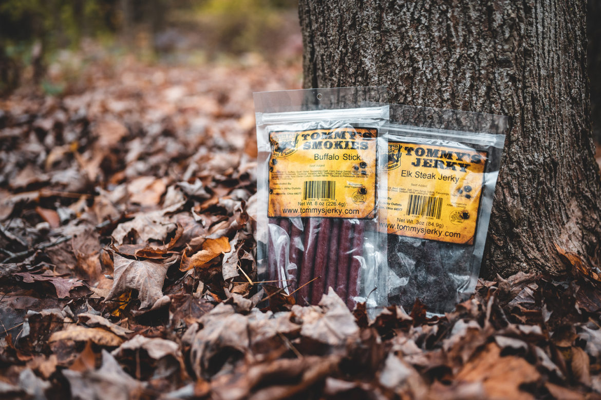 Beef stick and jerky in bag on tree in the leaves