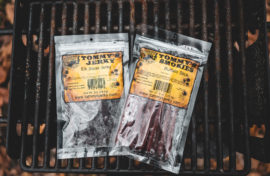 Beef stick and jerky in bag on grill