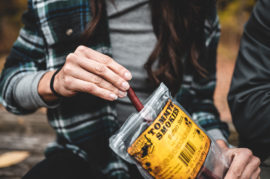 Lady holding beef stick