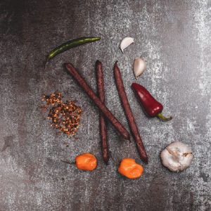 Beef stick with peppers, spices, and garlic