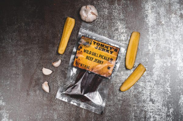 Beef jerky in bag with garlic and pickle slices