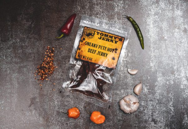 Beef jerky in bag with garlic, spices, and peppers